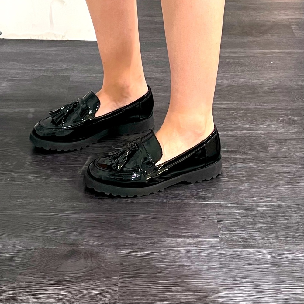 Lug sole loafers with tassels